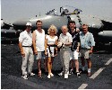 Paul Daniels and Debbie On deck on H.M.S. Illustrious with tour manager Richard